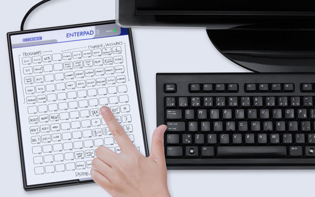 Enterpad on a desktop beside a regular keyboard